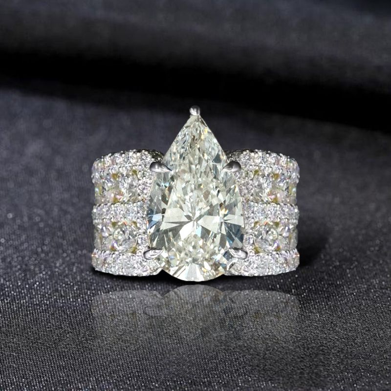 Multi Row Pave Solitaire Pear Cut White Sapphire Engagement Ring